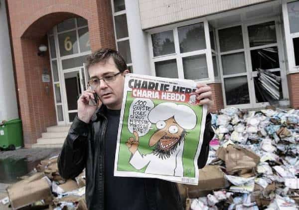 קריקטורה חדשה של מוחמד בצרפת: העיתון שעורכיו נרצחו בפריז לא נכנע לאסלאם הרדיקלי - "לעולם לא נוותר על האמת"